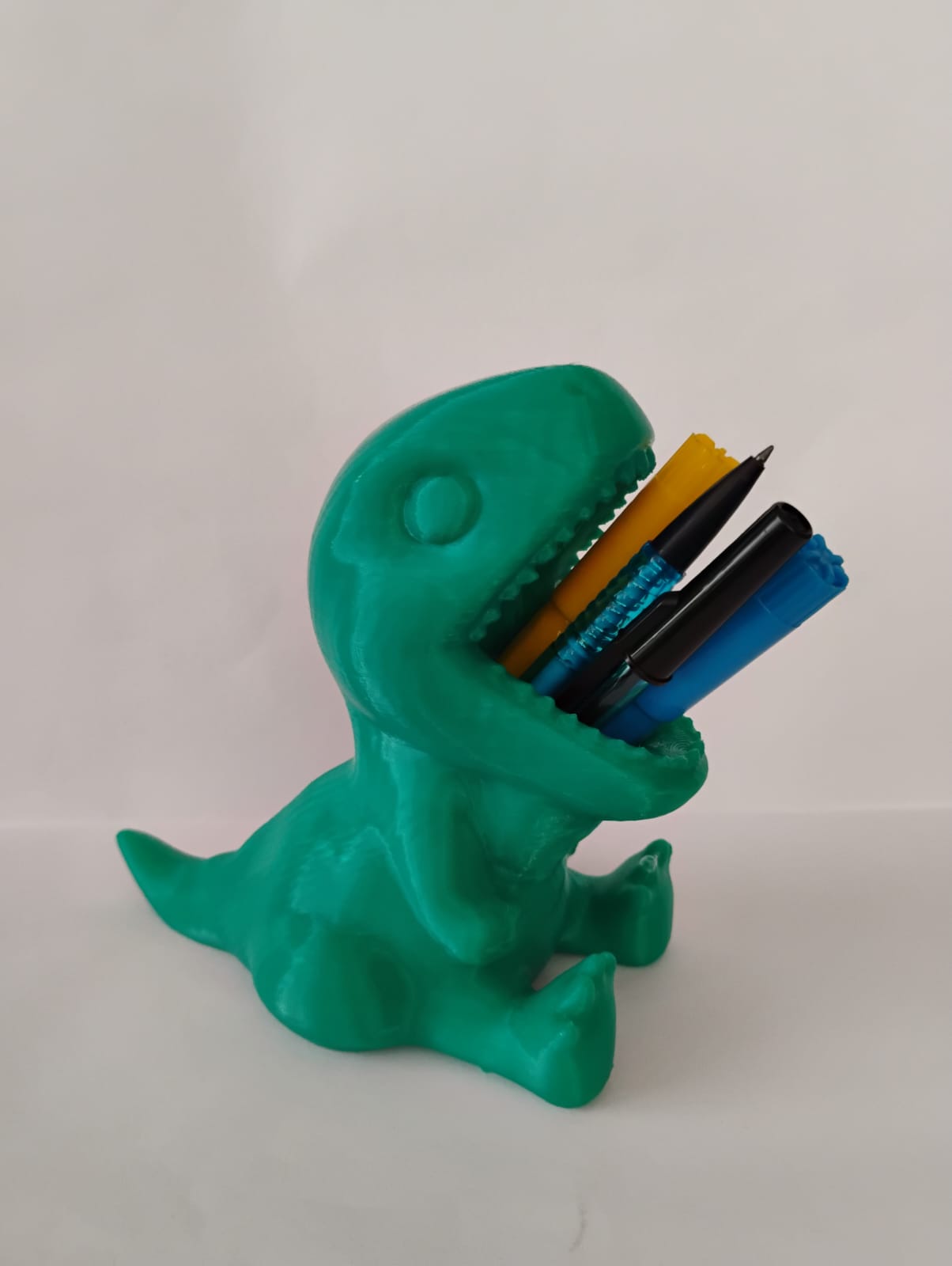 Porta treco de dinossauro